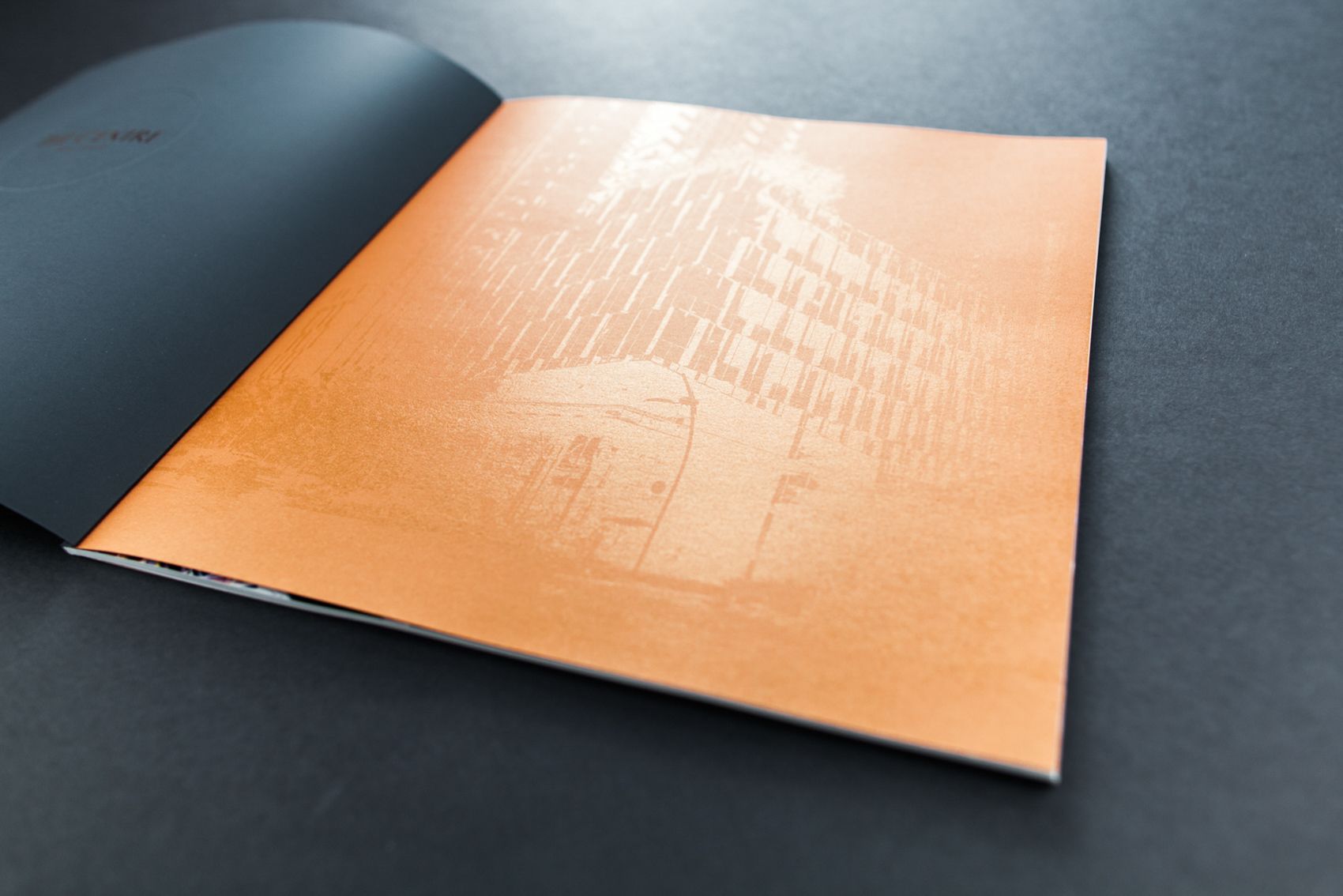 Orange front cover of the Centre brochure